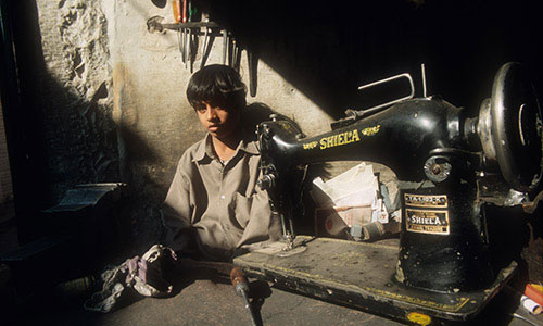 sewing_machine_repair_boy.jpg